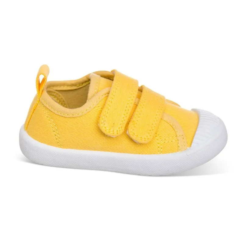 Lona color amarillo, fácil de combinar, con dos Velcros, puntera de goma y gran flexibilidad
