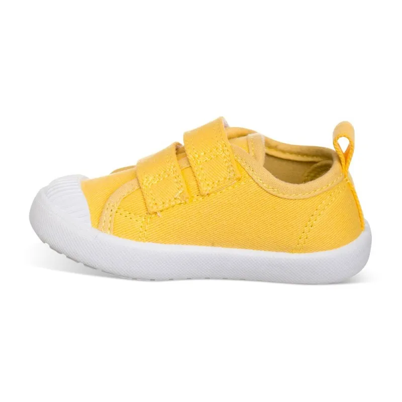 Lona color amarillo, fácil de combinar, con dos Velcros, puntera de goma y gran flexibilidad