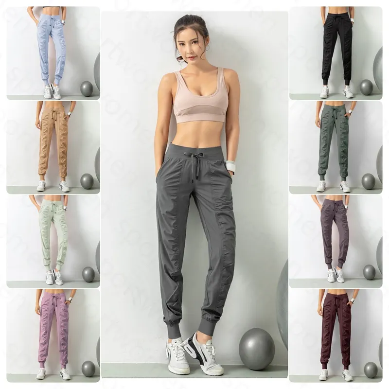 Pantalones de chándal tela shing running sport joggers mujeres fitness de gimnasio atlético seco rápido con dos bolsillos latera
