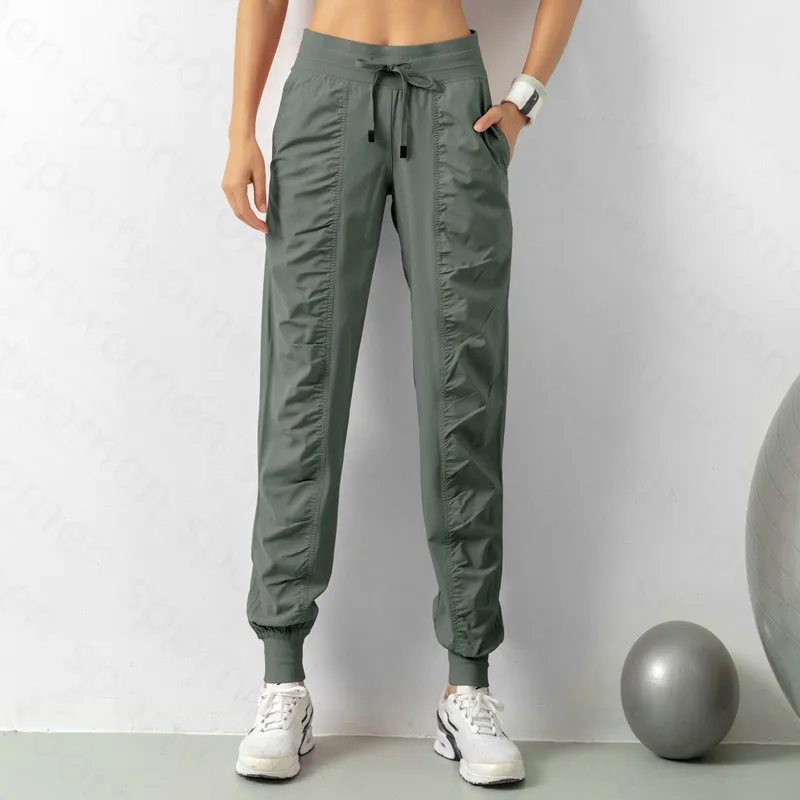 Pantalones de chándal tela shing running sport joggers mujeres fitness de gimnasio atlético seco rápido con dos bolsillos latera