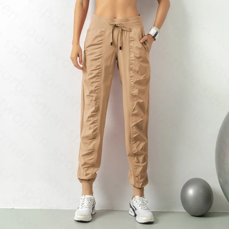 Pantalones de chándal tela shing running sport joggers mujeres fitness de gimnasio atlético seco rápido con dos bolsillos latera