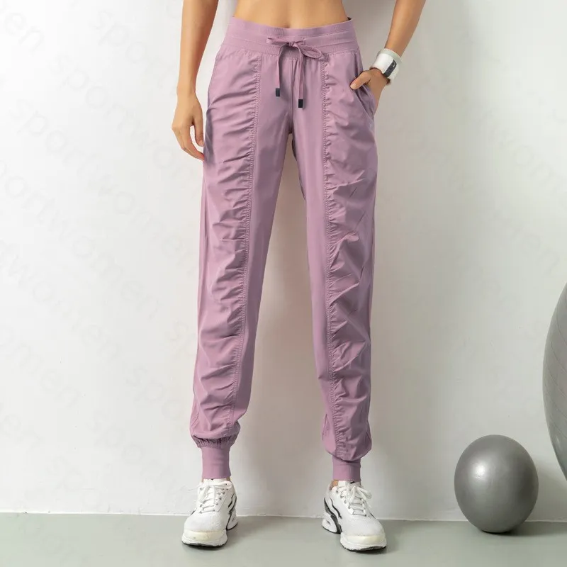 Pantalones de chándal tela shing running sport joggers mujeres fitness de gimnasio atlético seco rápido con dos bolsillos latera