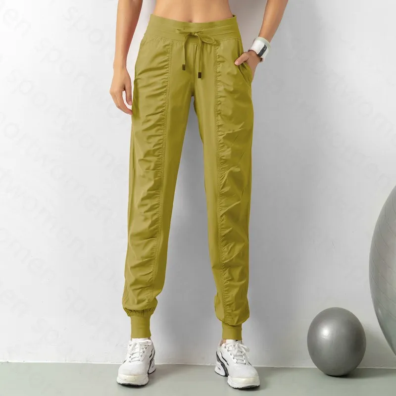 Pantalones de chándal tela shing running sport joggers mujeres fitness de gimnasio atlético seco rápido con dos bolsillos latera