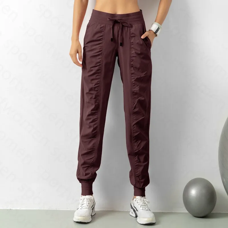 Pantalones de chándal tela shing running sport joggers mujeres fitness de gimnasio atlético seco rápido con dos bolsillos latera