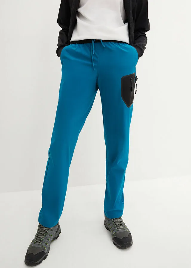 Pantalón elástico en 4 direcciones con material impermeable y bolsillos turquesa profundo
