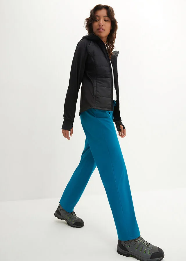 Pantalón elástico en 4 direcciones con material impermeable y bolsillos turquesa profundo